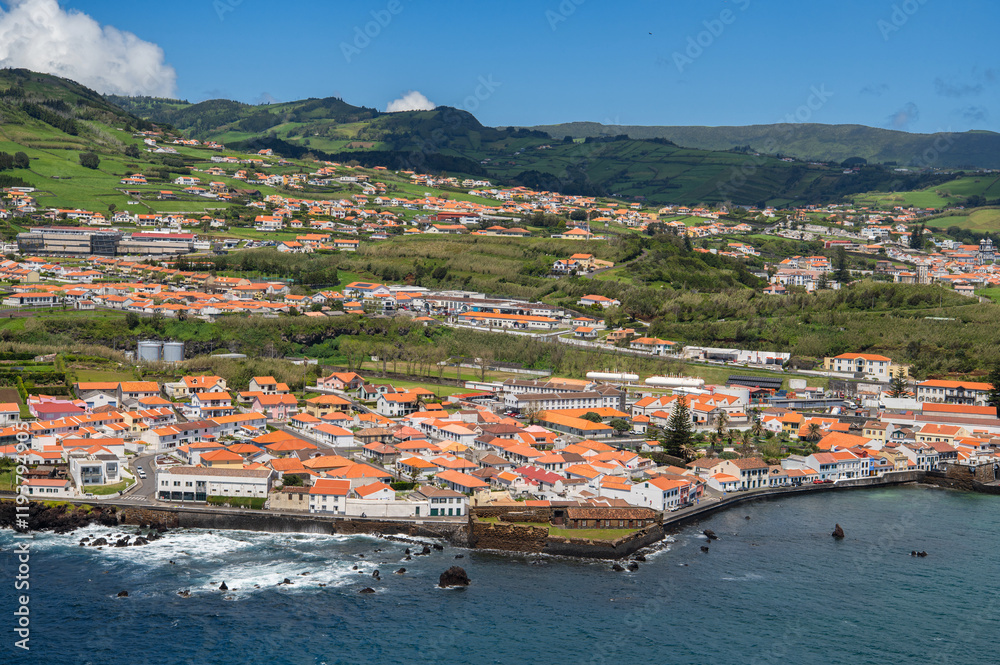 Obraz premium The City of Horta and Horta Bay Faial island of the Azores, Portugal. Aerial view of Portuguese town Horta on an the Atlantic ocean coast, on a sunny day, Faial island.