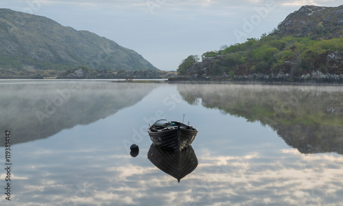 Ireland, Lough Leane. Boat and reflections on lake.