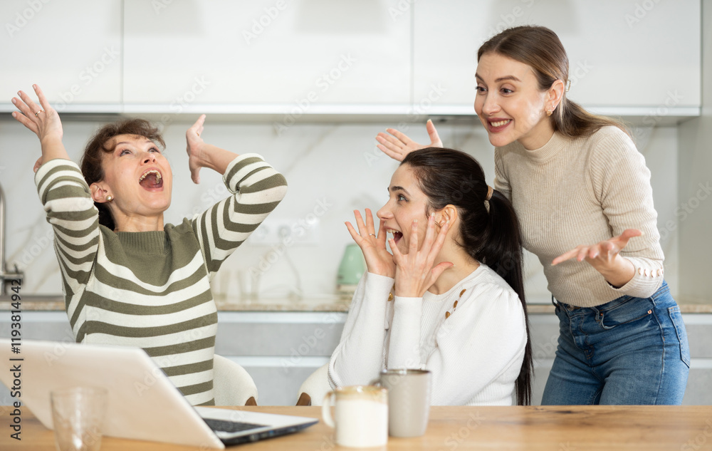 Women are sitting at computer and are immensely happy, exclaim joyfully and are fortunate to receive good news about win Women are sitting at computer and are immensely happy, exclaim joyfully and are fortunate to receive good news about win