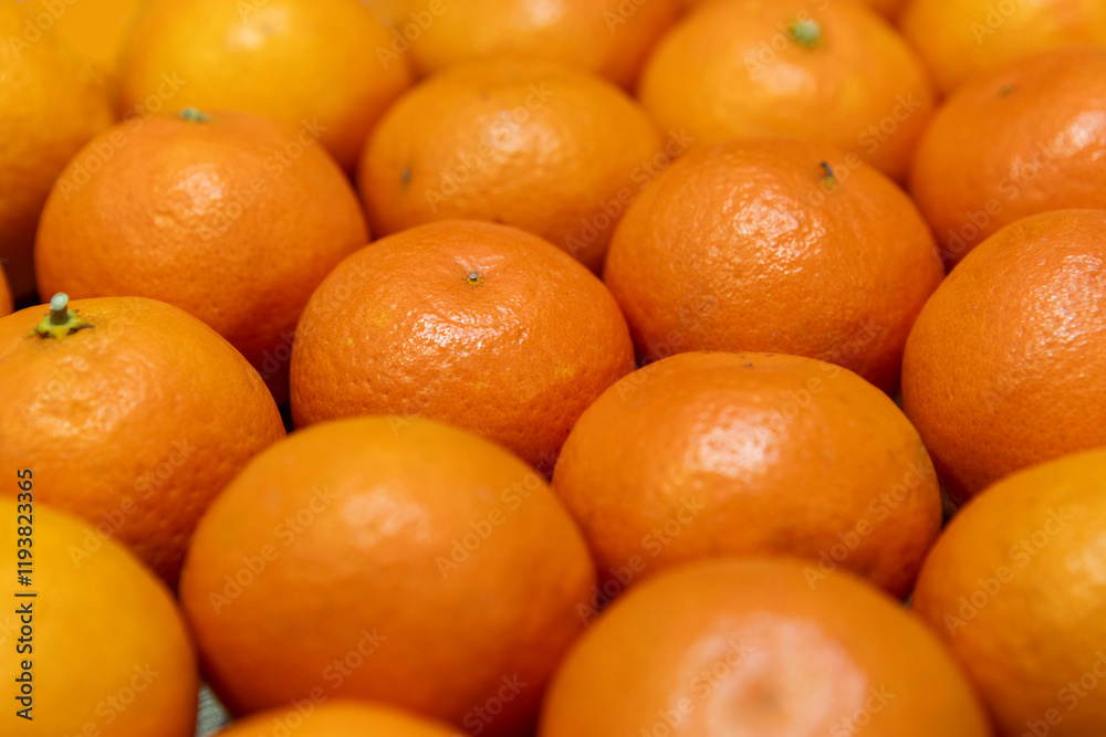 Lots of fresh juicy tangerines in their peels Lots of fresh juicy tangerines in their peels