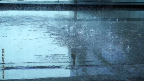 Capturing the beauty of summer rainstorm on a rainy day with close-up shots of raindrops on a smooth surface