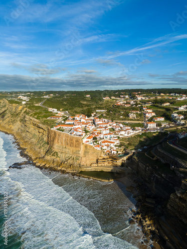 Azenhas do Mar Village on Sunny Day. Cliffs and Waves of Atlantic Ocean. Portugal. Aerial View photo