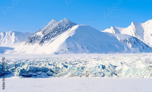 Glacier front of Fridtjovbreen and the frozen fjord Van Mijenfjorden. Landscape in Van Mijenfjorden National Park, (former Nordenskiold National Park), Island of Spitsbergen. Norway, Svalbard