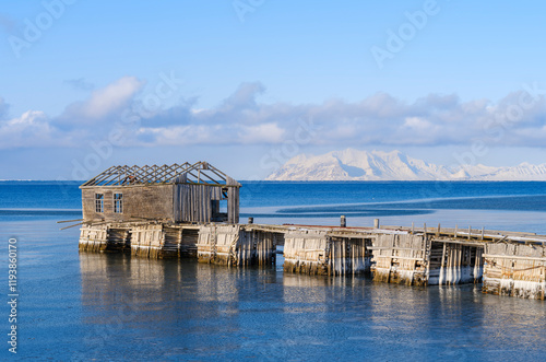 Ruins of Russian mining town. Coast of Colesbukta part of Isfjorden during winter, on the island of Spitsbergen in the Svalbard Archipelago. Arctic, Norway. photo