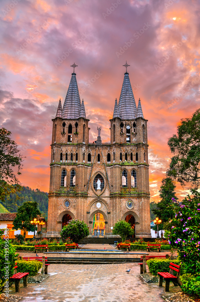 Obraz premium Minor Basilica of the Immaculate Conception in Jardin, Colombia with a dramatic sunrise sky