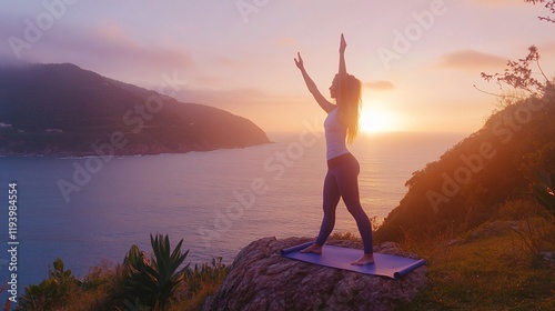 A person practicing yoga at sunset on a rocky outcrop by the sea.