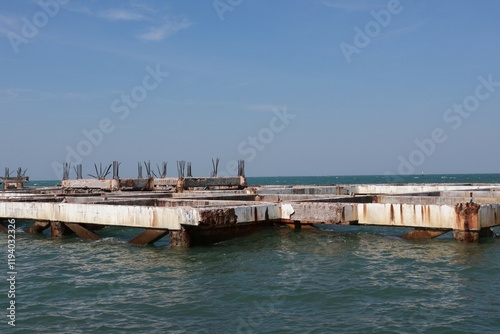 old building structure with rusty iron buildings in the sea