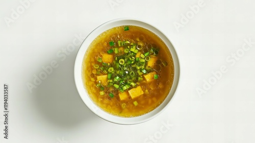 Wallpaper Mural A bowl of fragrant miso soup garnished with green onions and tofu, photographed from above on a clean white backdrop Torontodigital.ca