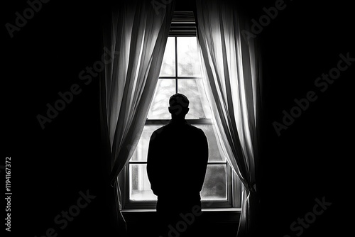 A silhouette of a man standing alone at a window in a dark room, gazing out while curtains gently sway in the breeze. photo