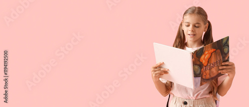 Cute schoolgirl reading boo...