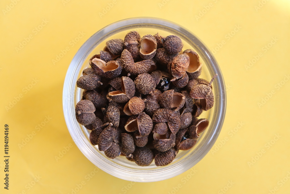 Sichuan pepper or Sichuanese pepper, Szechuan pepper, Chinese prickly ash, Chinese pepper, in a glass bowl Sichuan pepper or Sichuanese pepper, Szechuan pepper, Chinese prickly ash, Chinese pepper, in a glass bowl