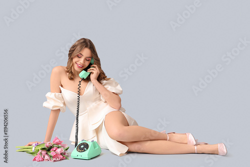 Young woman talking by retr...