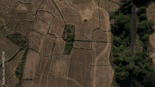 Aerial footage above rice fields harvested and the mountains who surround the area, Muang Ngoy, Luang Prabang province, Lao PDR photo