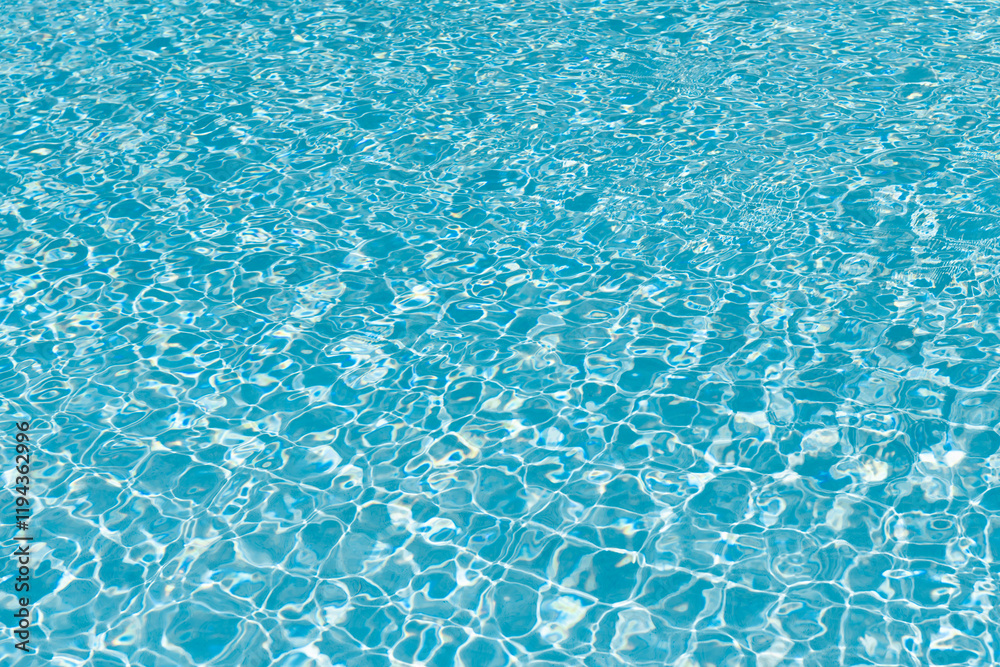 Spa resort on summer vacation. Pool side resort with pool water surface background. Sea ripples on blue pool background. Sea background. Swimming pool rippled. Summer vacation Spa resort on summer vacation. Pool side resort with pool water surface background. Sea ripples on blue pool background. Sea background. Swimming pool rippled. Summer vacation