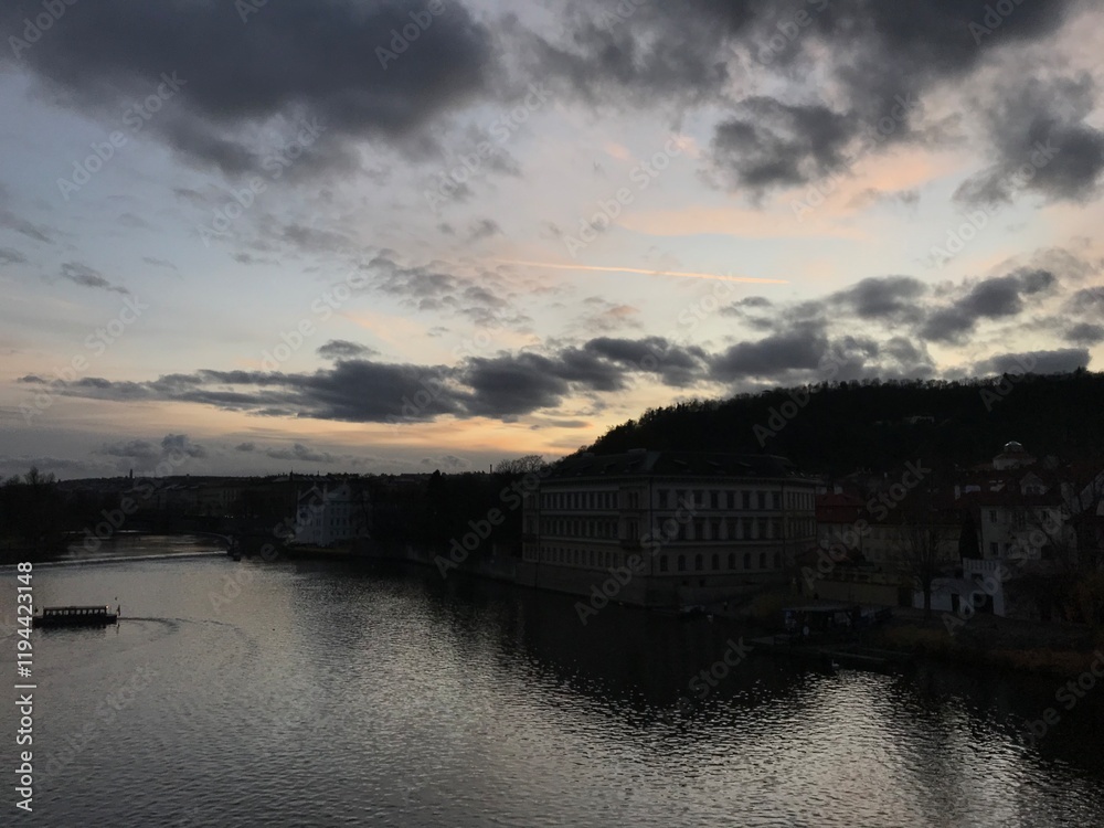 Obraz premium sunset over the river in old town, city