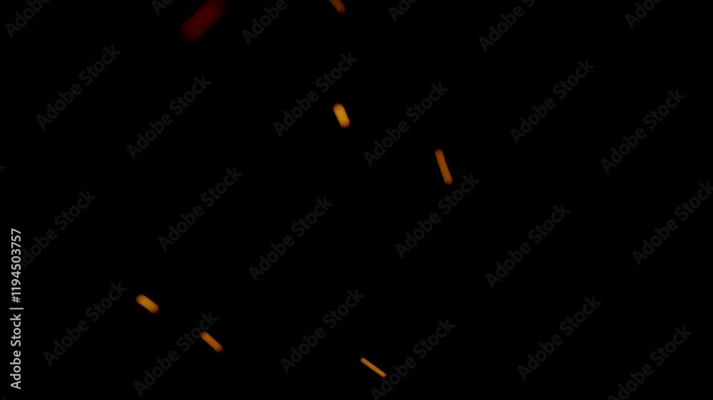 Dramatic close-up of intense flames with glowing ember particles on a black background, ideal for cinematic, fire, or abstract projects