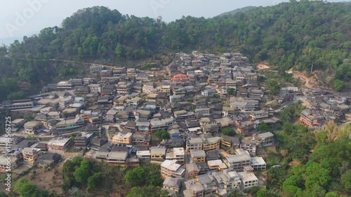 Explore the stunning aerial views of mountain villages in Jingmai, Yunnan showcasing unique architecture and lush landscapes photo