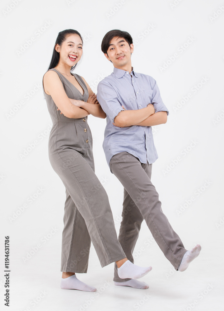 Portrait of young asian happy attractive cheerful couple love, Joyful sweethearts hugging embracing cuddle enjoy good time romantic date, posing to camera smiling standing together on white background Portrait of young asian happy attractive cheerful couple love, Joyful sweethearts hugging embracing cuddle enjoy good time romantic date, posing to camera smiling standing together on white background