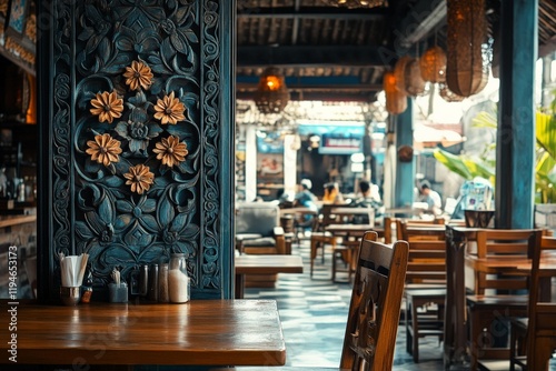 The image captures a beautifully ornate wooden panel featuring floral carvings in a cozy, rustic restaurant setting with wooden furniture and a warm ambiance. photo