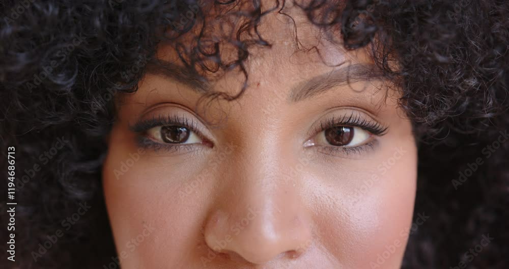 Close-up of person face with neutral expression, looking directly at camera