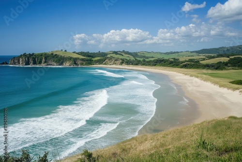 Tranquil beachscape featuring soft blue surf and fine sand for travel enthusiasts and holiday promotions photo