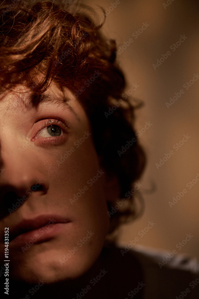 Medium close up of handsome part of male face looking away Medium close up of handsome part of male face looking away