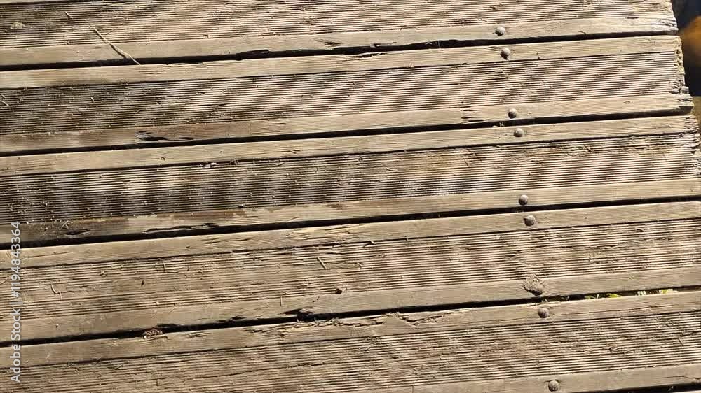 Wooden Bridge Made of Timber Logs and Planks with Nails Leading Through a Rustic Landscape Grunge Path Wooden Bridge Made of Timber Logs and Planks with Nails Leading Through a Rustic Landscape Grunge Path