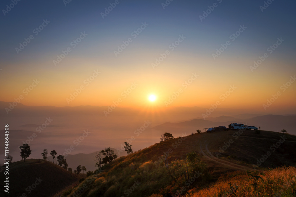 Beautiful scenery of the sea of mist in the morning at the Car Camping site with a viewpoint nature at Doi Ba Lu Kho Mountain in Mae Chaem, Chiang Mai, Thailand. Background concept. Beautiful scenery of the sea of mist in the morning at the Car Camping site with a viewpoint nature at Doi Ba Lu Kho Mountain in Mae Chaem, Chiang Mai, Thailand. Background concept.