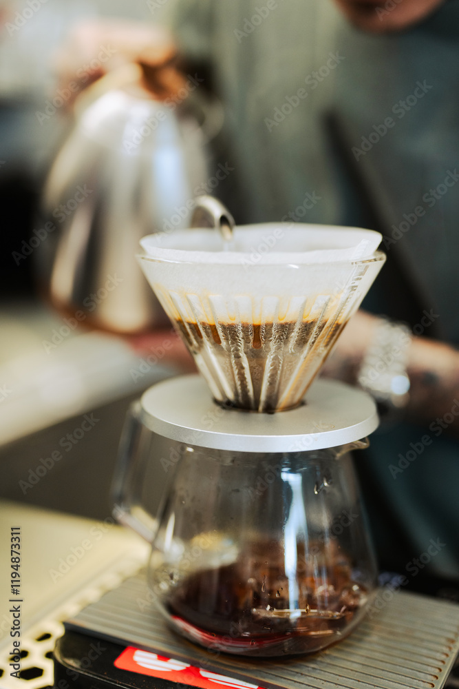 Pouring the hot water for dripping the coffee. Professional barista Pouring the hot water for dripping the coffee. Professional barista