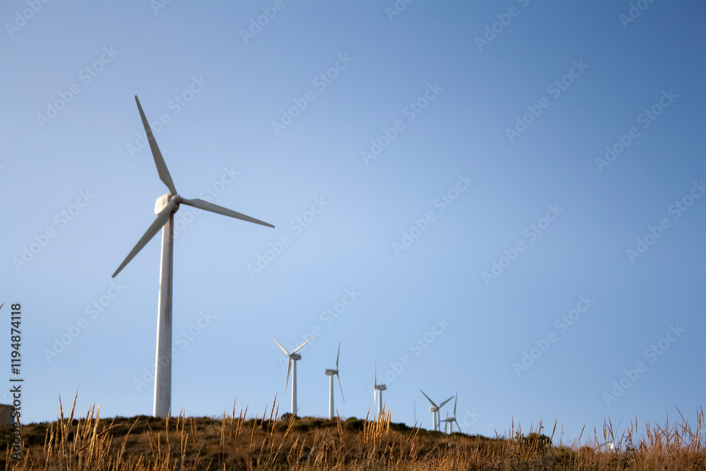 Wind turbines on a sunny day with clear skies Wind turbines on a sunny day with clear skies