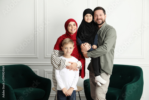 Happy Muslim family spending time together at home photo