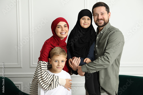 Happy Muslim family spending time together at home photo