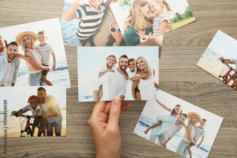 © New Africa - Woman with different photos at wooden table, top view © New Africa - Woman with different photos at wooden table, top view