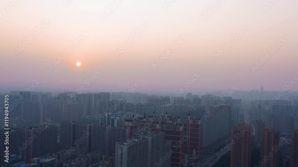 Stunning aerial view of city skyline during sunset with nighttime illumination Stunning aerial view of city skyline during sunset with nighttime illumination
