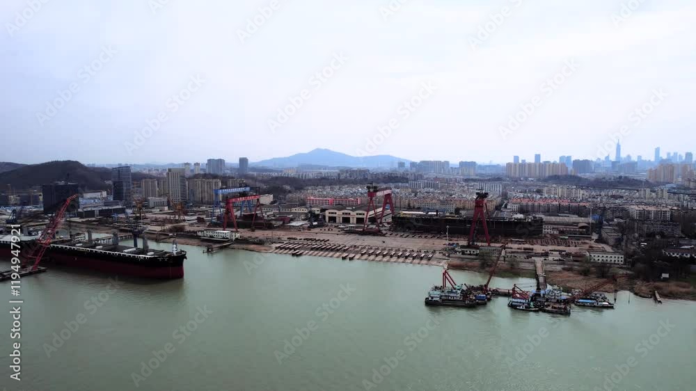 Explore Nanjing Shipyard along the Yangtze River with stunning aerial views showcasing industry and cityscape Explore Nanjing Shipyard along the Yangtze River with stunning aerial views showcasing industry and cityscape