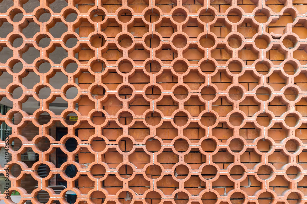 Latticed screen made with red clay hollow jali bricks Latticed screen made with red clay hollow jali bricks