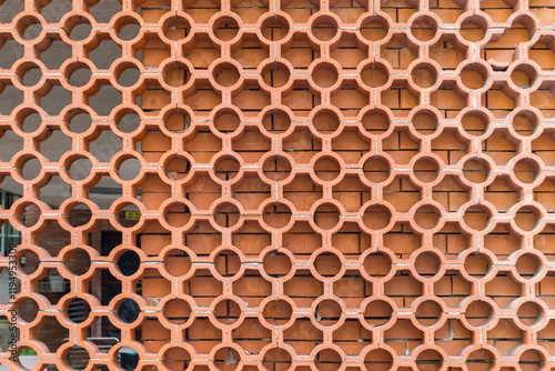 Latticed screen made with red clay hollow jali bricks photo