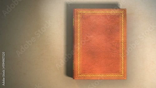 Leather covered book with ornaments lying on the table. Book opening with turning pages. Includes Mate for Transition.
