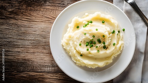Creamy pasta dish on white plate, rich alfredo sauce with parsley garnish, rustic wooden table setting, elegant dining theme.