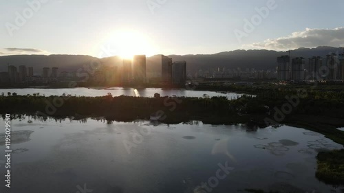 Explore Qinghua Sea National Wetland Park at Sunset for breathtaking views and tranquil nature photo