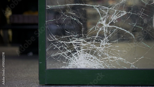 Damaged store entrance broken glass vandalism