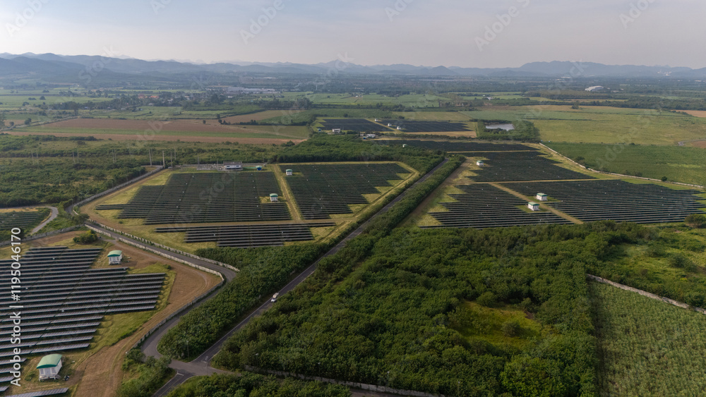 Fototapeta premium Aerial bird view photo of photovoltaic power station also known as a solar park is large-scale photovoltaic system (PV system) designed for the supply of merchant power into the electricity grid