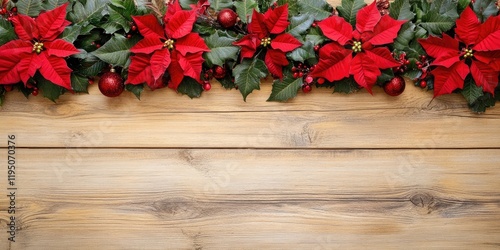 Christmas border with vibrant red poinsettias and festive decorations on warm wooden background, blank space for text centered at bottom.