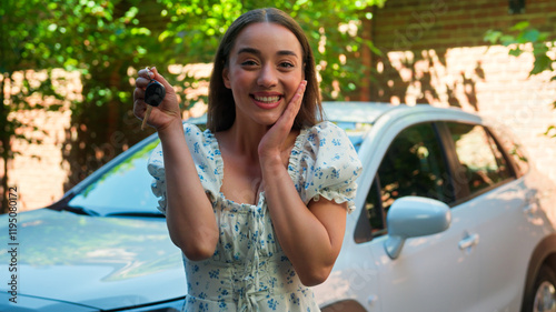 Tableau sur toile Happy euphoric smiling Caucasian woman female car owner driver girl auto buyer r