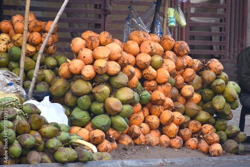 Roadside Fresh Fruit Green Coconut and Coconut with all its skinn are up for sale. photo