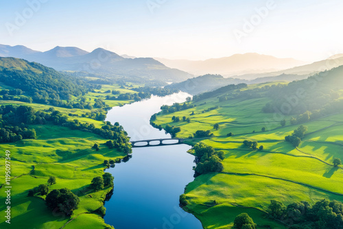 River with Bridge and Green Landscape at Sunrise photo