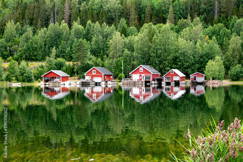 Red houses at sunset on a lake, Höga Kusten, Sweden photo