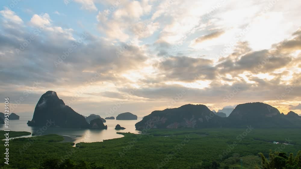 Time lapse view Phang Nga bay with mountain and cliff with stunning morning sunrise and beautiful sky. Landscape scene from Samet Nangshe viewpoint famous nature travel landmark of Thailand. Time lapse view Phang Nga bay with mountain and cliff with stunning morning sunrise and beautiful sky. Landscape scene from Samet Nangshe viewpoint famous nature travel landmark of Thailand.