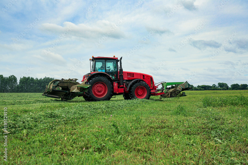 tractor. haying. harvesting grass. farming tractor. haying. harvesting grass. farming