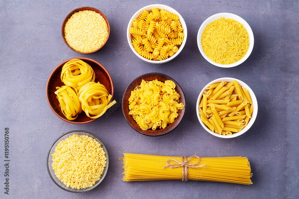 Assorted Uncooked Pasta in Bowls on Wooden Table